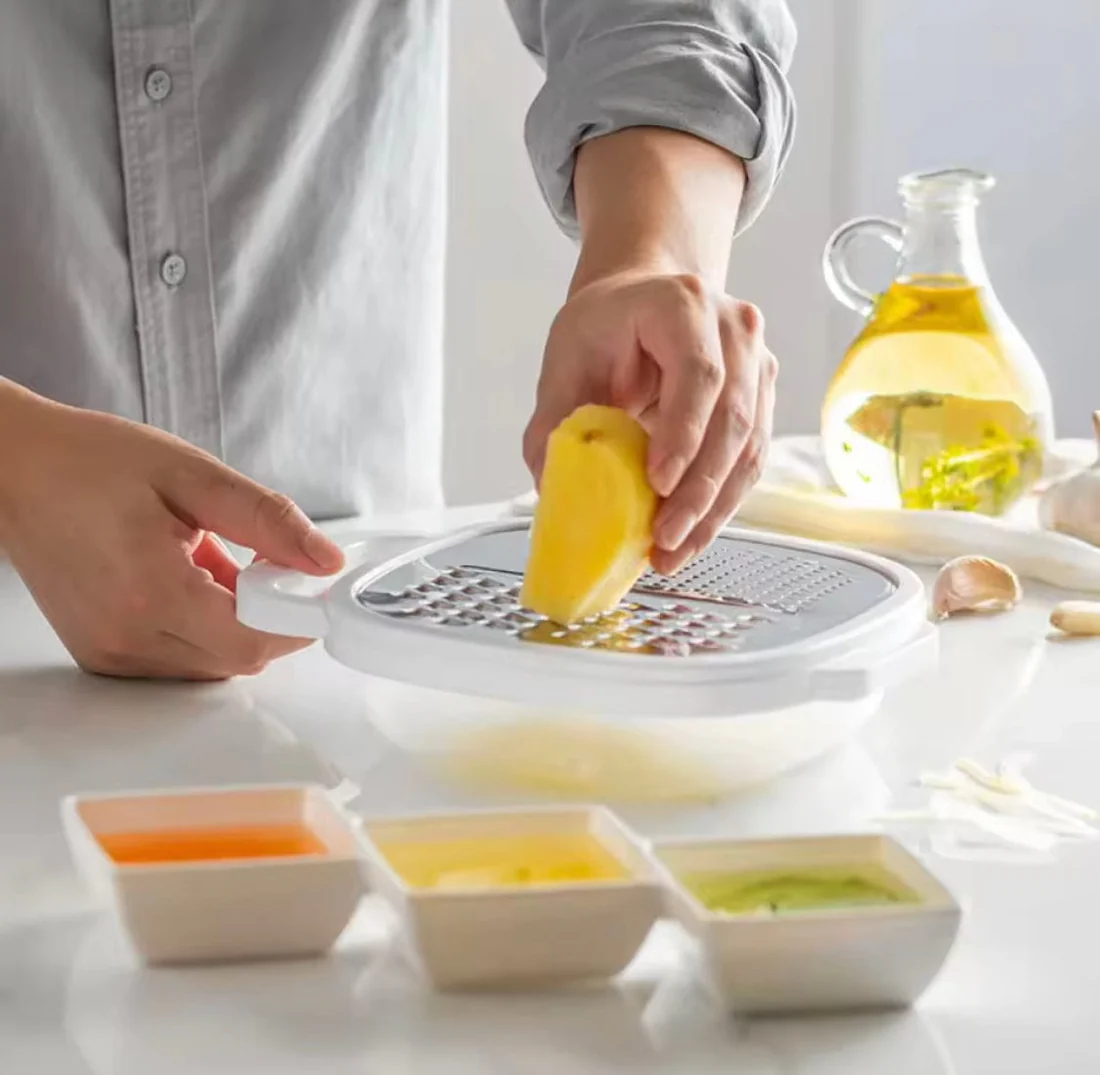 4-in-1 multi grater with case, cover, slicer, shredder kitchen tool